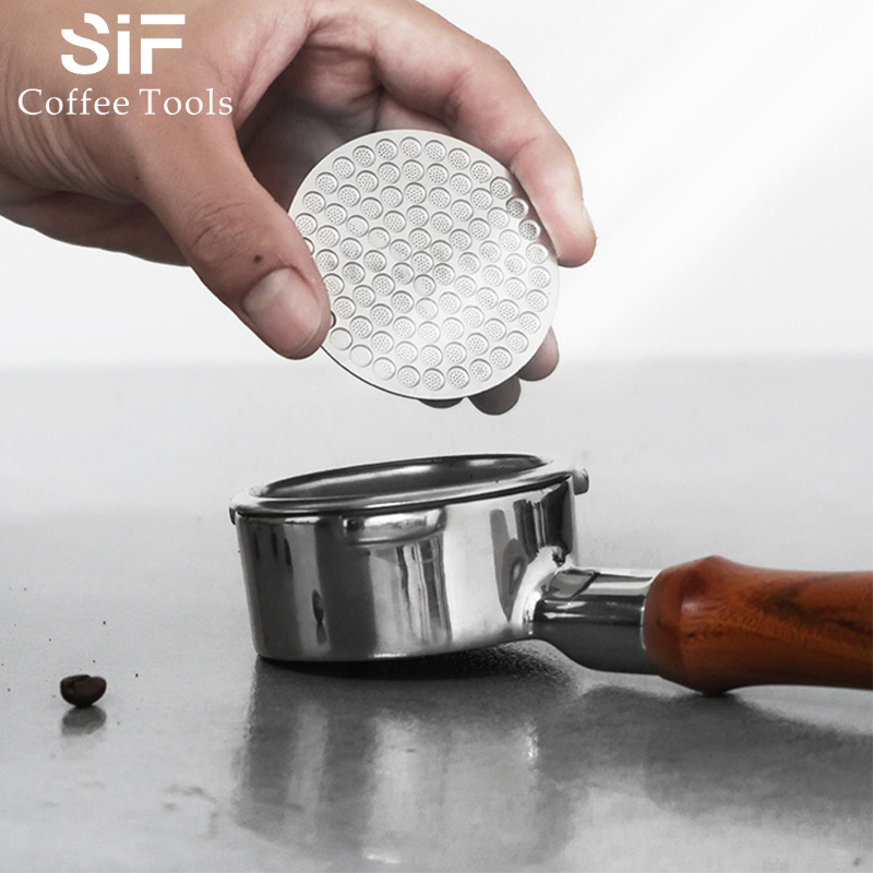 A perfect, well-formed spent coffee puck