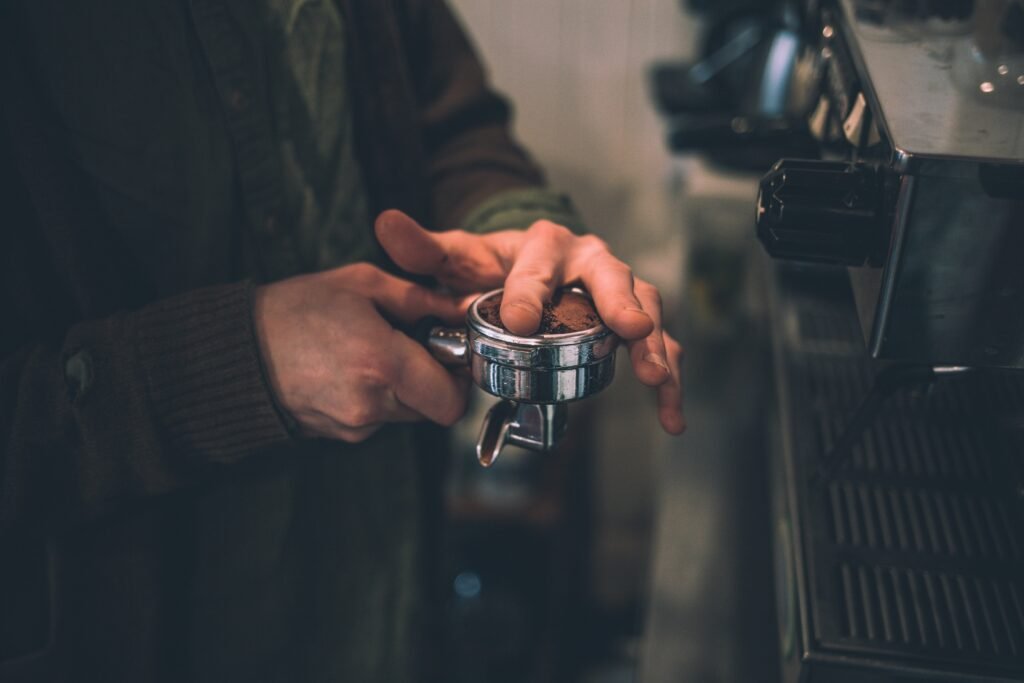 tamping coffee in single basket