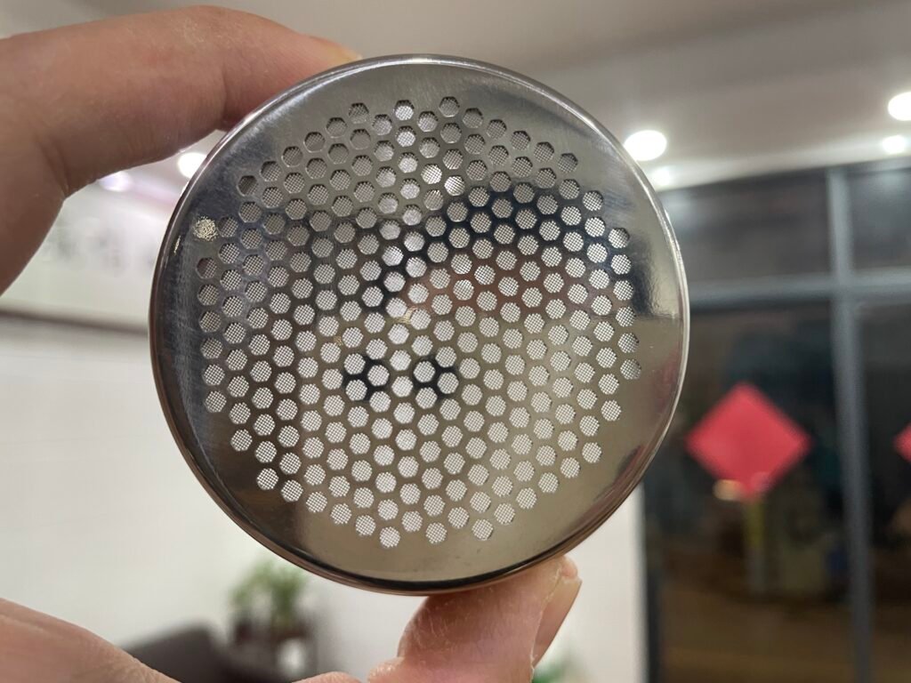 Close-up of the precision-engineered holes in a filter basket