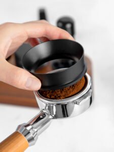 Dosing funnel 54mm placed on Breville espresso machine portafilter