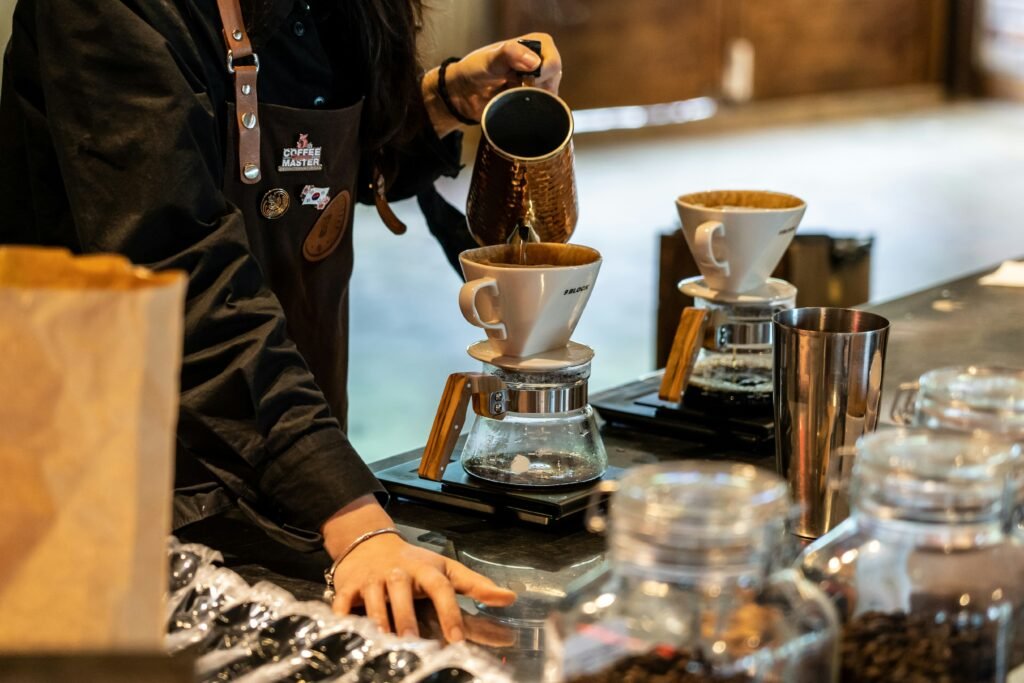 alt text: Close-up of water being poured in circles into a V60