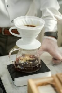 barista using scale for pour over