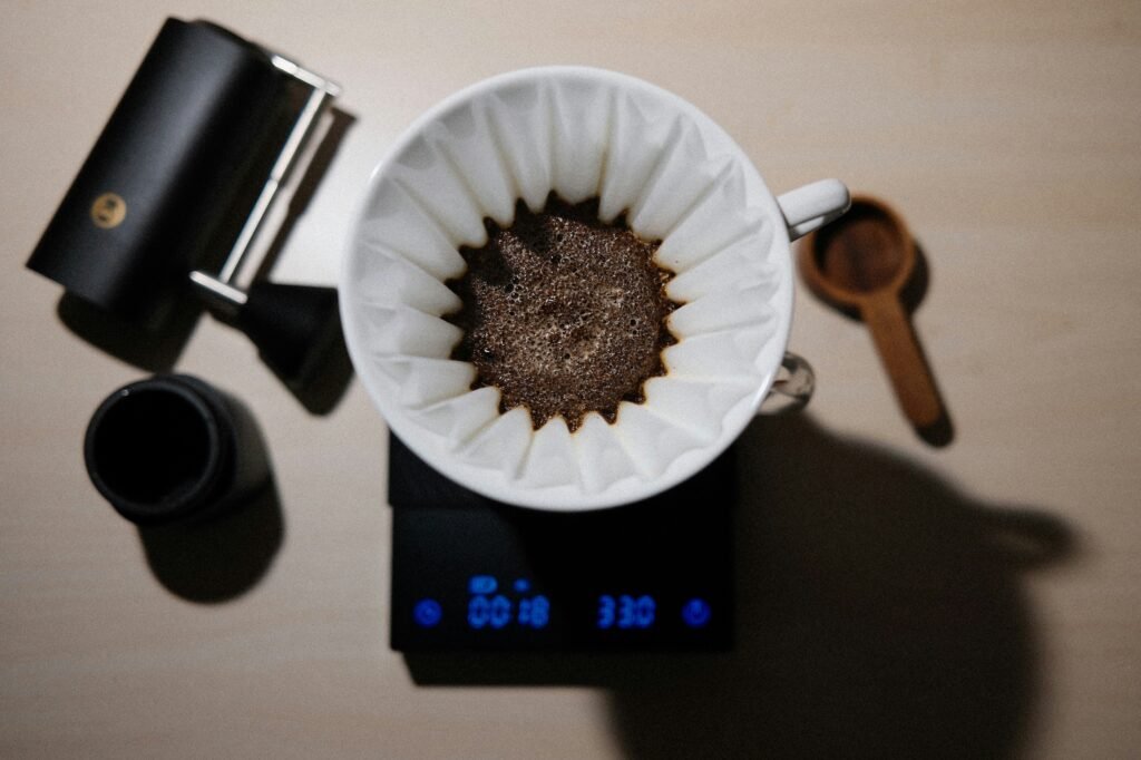 A custom branded barista scale with a logo on a stylish coffee bar