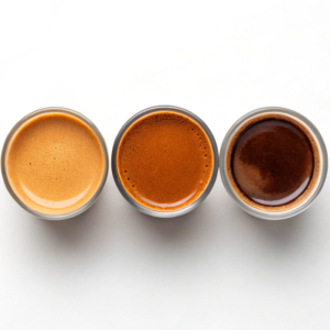 Bottomless portafilter extraction showing perfect tiger-striped espresso flow