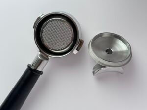 2-in-1 coffee portafilter showing both bottomless and spouted conversion modes