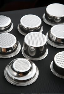 Close-up view of precision coffee filter basket hole pattern